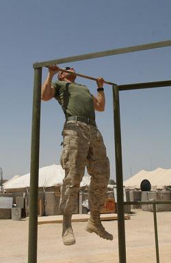 soldier performing pull ups on bar