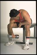 man working out with dumbbell